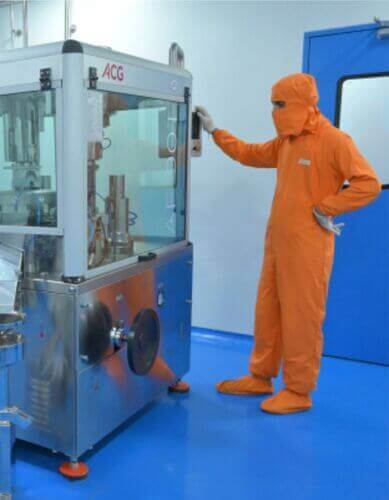 Operator at process equipment inside the plant
