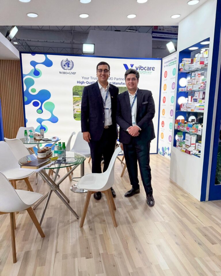 Vibcare Healthcare staff with a visitor at CPHI India 2024