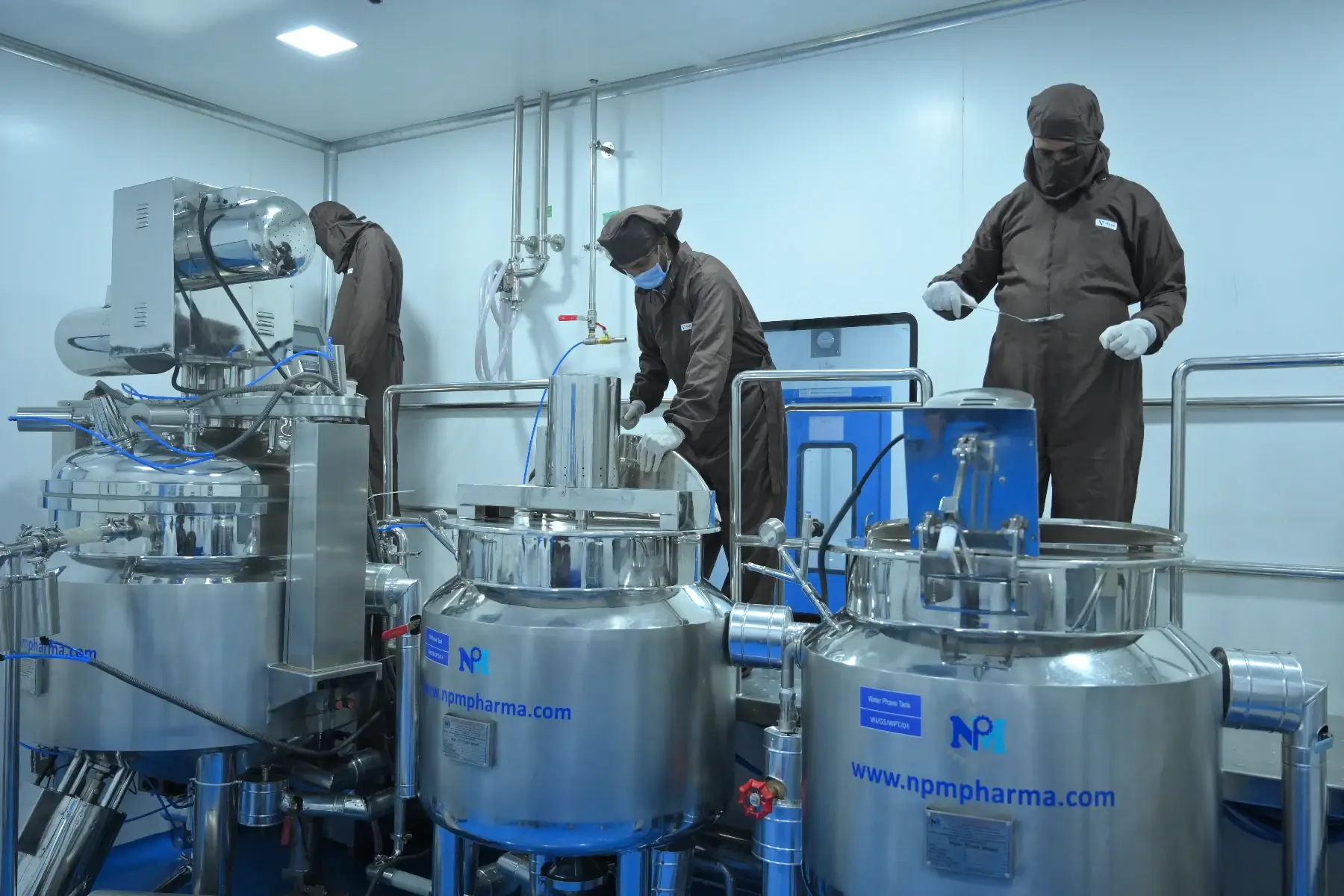 Operators at the ointment and cream manufacturing vessels