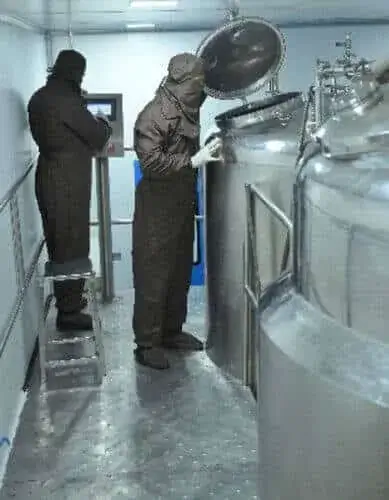 Operators at a manufacturing vessel